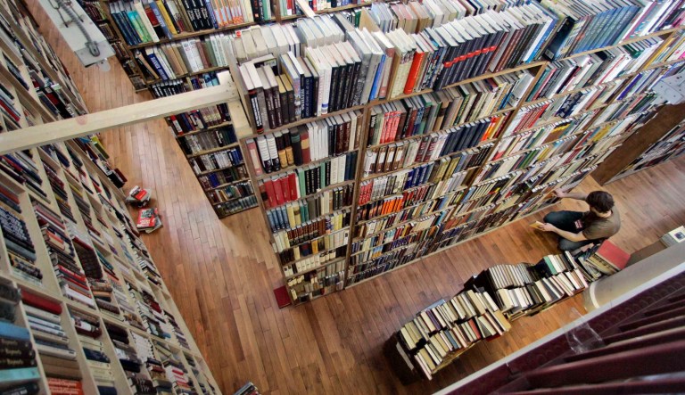 An employee of the Strand bookstore sorts the books in this Feb. 21, 2007 file photo in New York. The Strand is one place you could go to find out if your books have anything more than sentimental value.