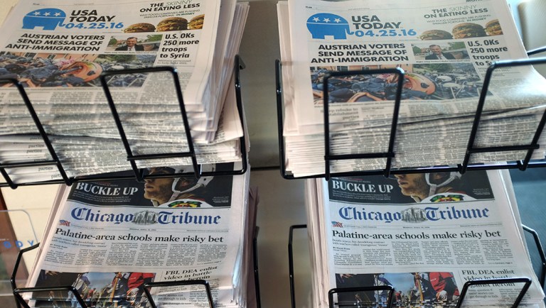USA Today, Chicago Tribune and other newspapers are displayed at Chicago's O'Hare International Airport.
