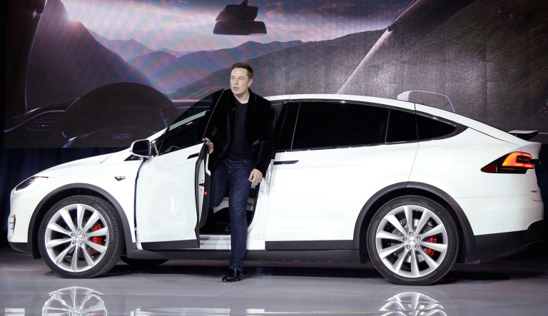 Elon Musk, CEO of Tesla Motors Inc., exits from the Model X car at the company's headquarters in Fremont, Calif.