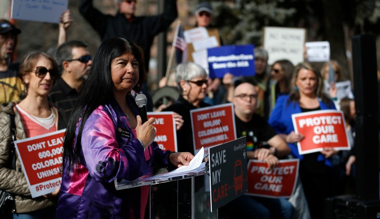 Supporters of the Affordable Care Act who are also opponents of Colorado's GOP-led plan to undo Colorado's state-run insurance exchange during a rally. 