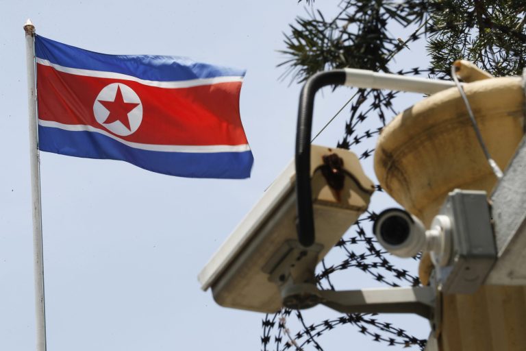 A North Korean flag flies above a CCTV surveillance camera attached on the entrance gate at the North Korean Embassy in Kuala Lumpur, Malaysia, Monday, March 13, 2017. Malaysia's health minister said Monday that the government will give relatives of North Korean leader Kim Jong Un's estranged half brother two to three weeks to claim his body before deciding what to do with it. 