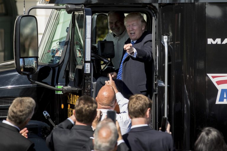 President Donald Trump sits in an 18-wheeler truck while meeting with truckers and CEOs regarding healthcare on the South Lawn of the White House in Washington, Thursday, March 23, 2017.