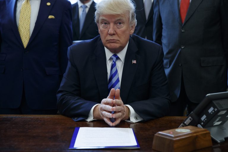 President Donald Trump pauses in the Oval Office of the White House in Washington Friday, March 24, 2017, where it was announced the approval of a permit to build the Keystone XL pipeline, clearing the way for the $8 billion project, Friday, March 24, 2107, in the Oval Office of the White House in Washington.