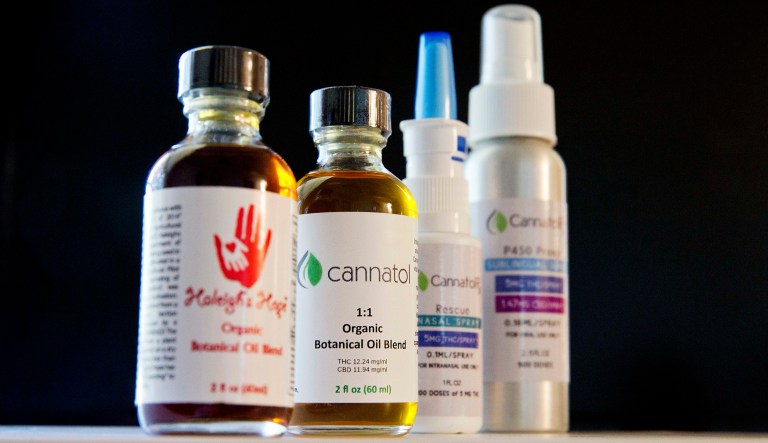 Various cannabis oil products are displayed. 