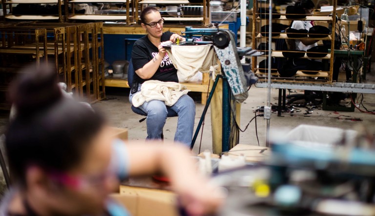 Amaryllis Garman, top, takes part in the manufacturing of Kangol hats the Bollman Hat Company in Adamstown, Pa.