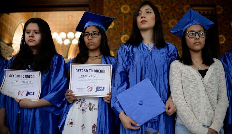 Immigrant students without legal status stand in the gallery of the Hall of the House on the final day of session at the State Capitol, Wednesday, June 7, 2017, in Hartford, Conn.