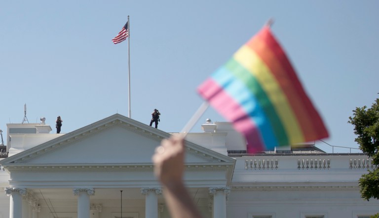 Equality March for Unity and Pride participants march past the White House in Washington, Sunday, June 11, 2017. 