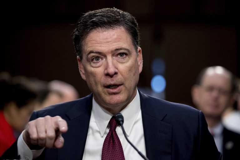 FILE - In this Thursday, June 8, 2017, file photo, former FBI director James Comey speaks during a Senate Intelligence Committee hearing on Capitol Hill, in Washington. Comey has a book deal. Flatiron Books told The Associated Press on Wednesday, Aug. 2, that Comey will write about everything from allegations of ties between Russia and Donald Trump's presidential campaign to the bureau's investigation into Hillary Clinton's use of a private email server.