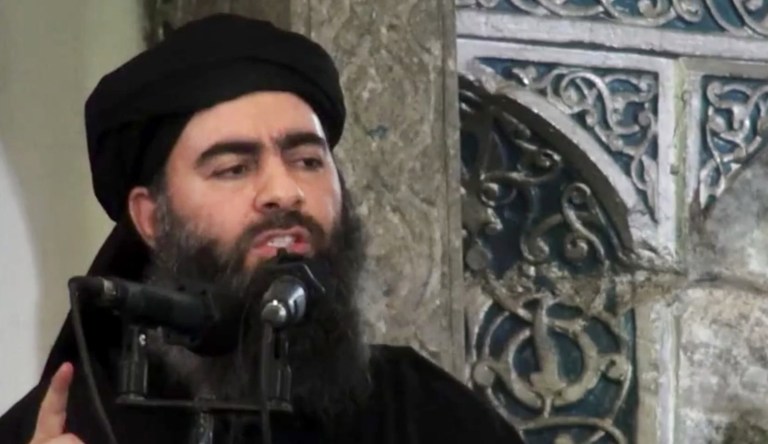 This image made from video posted on a militant website Saturday, July 5, 2014, purports to show the leader of the Islamic State group, Abu Bakr al-Baghdadi, delivering a sermon at a mosque in Iraq during his first public appearance. 