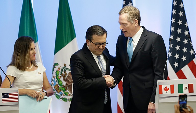Canada's Foreign Minister Chrystia Freeland looks on as Mexico's Economy Secretary Ildefonso Guajardo Villarreal and U.S. Trade Representative Robert Lighthizer shake hands after a round of NAFTA renegotiations in Mexico City on Sept. 5, 2017.