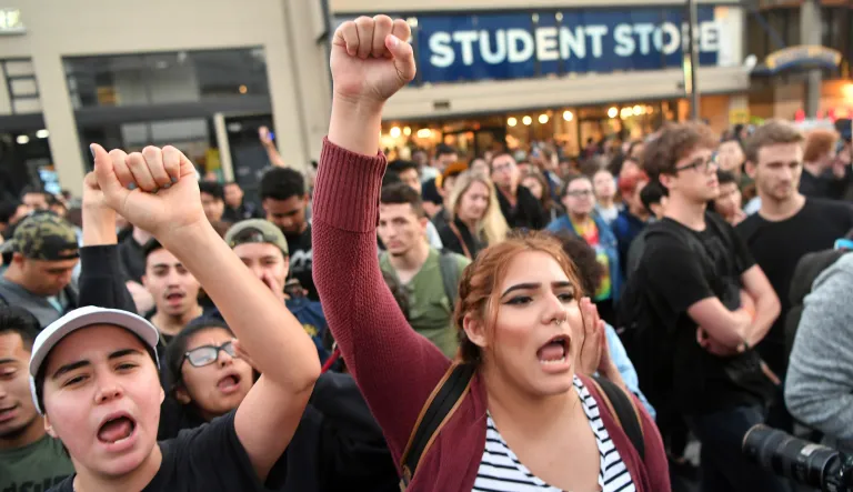 Protesters shout before a speaking engagement by Ben Shapiro on the campus of the University of California Berkeley in Berkeley, Calif., Thursday, Sept. 14, 2017. 