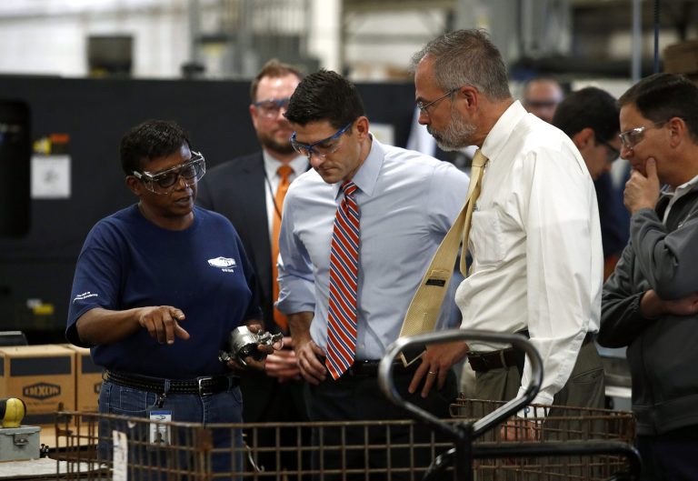 Dixon Valve & Coupling Company employee Toni Durant, left, speaks with Speaker of the House Paul Ryan, R-Wis., center, and Rep. Andy Harris, R-Md., right, during a factory tour prior to a tax reform town hall with employees in Chestertown, Md., Thursday, Oct. 5, 2017.