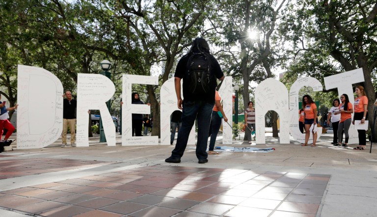Immigrant rights supporters hold giant letters reading "Dream Act" as they demonstrate in favor of Congress passing a 'Clean Dream Act' that will prevent the deportation of young immigrants known as "Dreamers" working and studying in the U.S. in Miami.