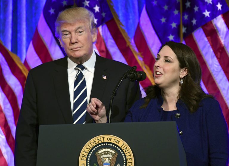 President Donald Trump, left, listens as Republican National Committee chairwoman Ronna Romney McDaniel, right, speaks at a fundraiser at Cipriani in New York, Saturday, Dec. 2, 2017. Here RNC has raised $213 million the fastest ever.