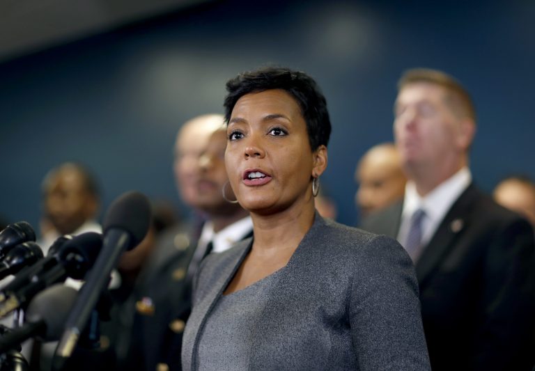 Mayor Keisha Lance Bottoms speaks at a press conference in Atlanta, Thursday, Jan. 4, 2018. Atlanta's mayor is promising a "safe, smooth and secure" college football championship game Monday, despite the traffic problems expected to be caused by President Donald Trump's motorcade, but none of the many agencies involved are taking any chances.