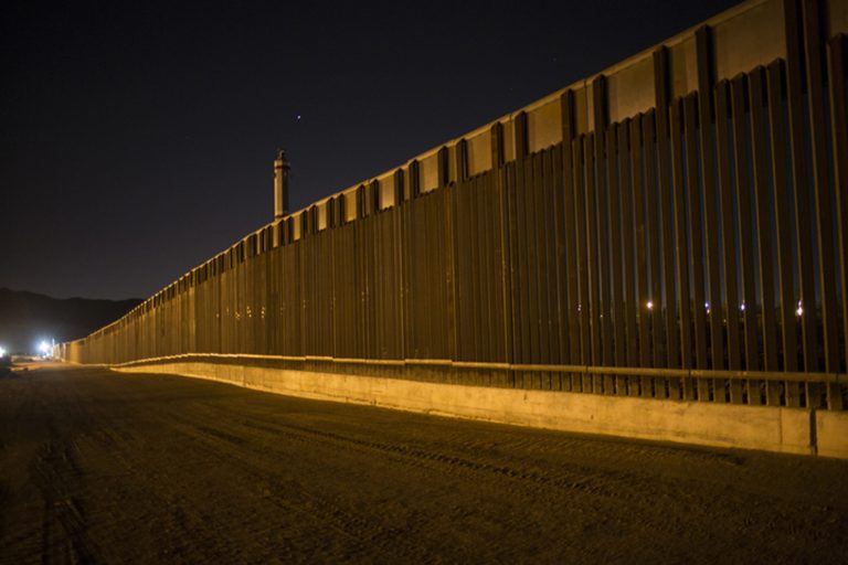 This photo shows a portion of a steel border fence that stretches along the US-Mexico border in Sunland Park, N.M.