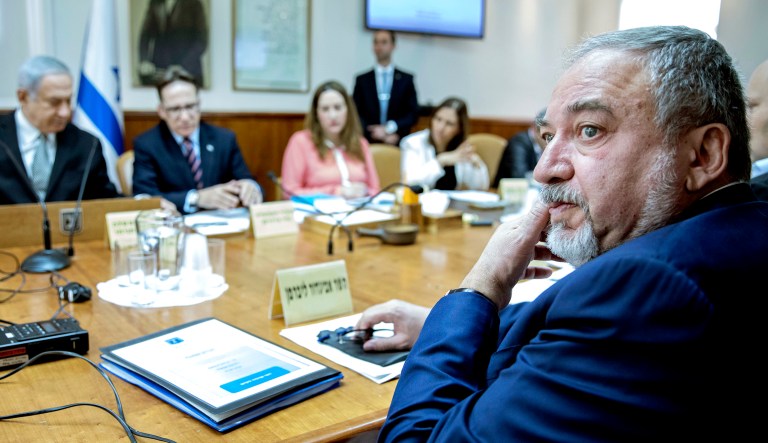 Israeli Minister of Defense Avigdor Lieberman (right) attends a cabinet meeting chaired by Prime Minister Benjamin Netanyahu (left) in Jerusalem on Feb. 4, 2018.
