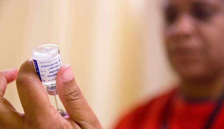 Nurse Nicole Simpson prepares a flu shot from a vaccine vile at the Salvation Army in Atlanta, Wednesday, Feb. 7, 2018. The U.S. government's latest flu report released on Friday, Feb. 2, 2018, showed flu season continued to intensify the previous week, with high volumes of flu-related patient traffic in 42 states, up from 39 the week before.