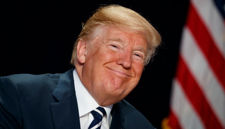 President Trump smiles during the National Prayer Breakfast, Thursday, Feb. 8, 2018, in Washington.