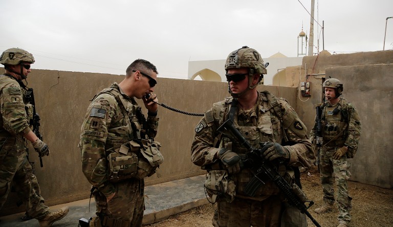 In this Jan. 25, 2018, photo, American troops coordinate with Iraqi counterparts to launch airstrikes and artillery from a small complex in the town of Qaim, Iraq. As the fight against IS in Syria grinds on, Iraqi troops stationed in western Iraq near the border continue to call on coalition forces for help sharing intelligence and launching strikes. Thousands of U.S. troops and billions of dollars spent by Washington helped bring down the Islamic State group in Iraq, but many of the divisions and problems that helped fuel the extremistsâ rise remain.