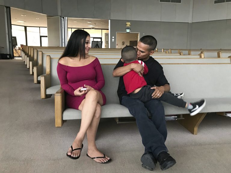 Jesus Berrones holds his five-year-old son, Jayden, as his wife, Sonia, looks on at the Shadow Rock United Church of Christ in Phoenix Monday, Feb. 12, 2018, where he has sought sanctuary to avoid deportation back to his native Mexico. The church is among congregations around the US who allow some special cases of immigrants scheduled for deportation to stay in their sanctuaries until the legal threat has passed. Jayden was diagnosed with leukemia in 2016 and is undergoing a three-year course of chemotherapy.