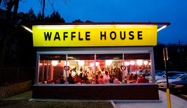 Diners eat at a Waffle House restaurant.