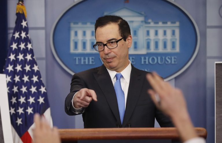 Treasury Secretary Steve Mnuchin gestures as he answers questions during a press briefing at the White House in Washington, Friday, Feb. 23, 2018. The Trump administration announced new sanctions on more than 50 vessels, shipping companies and trade businesses in its latest bid to pressure North Korea over its nuclear program.