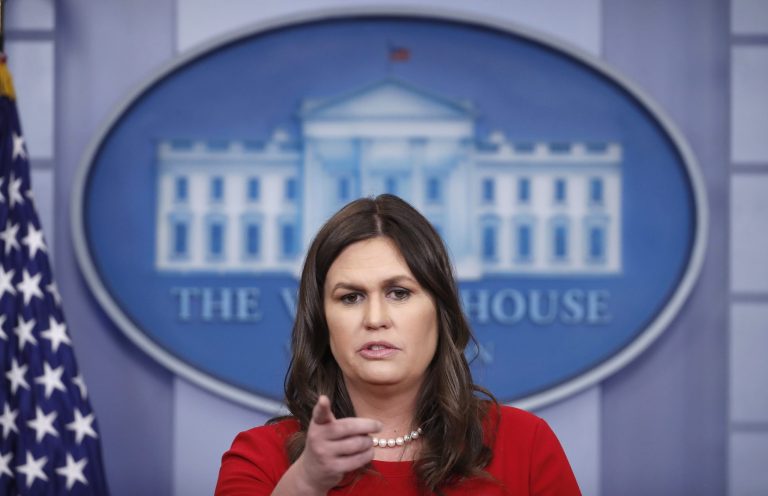 White House press secretary Sarah Huckabee Sanders points to a reporter as she speaks during a press briefing at the White House.
