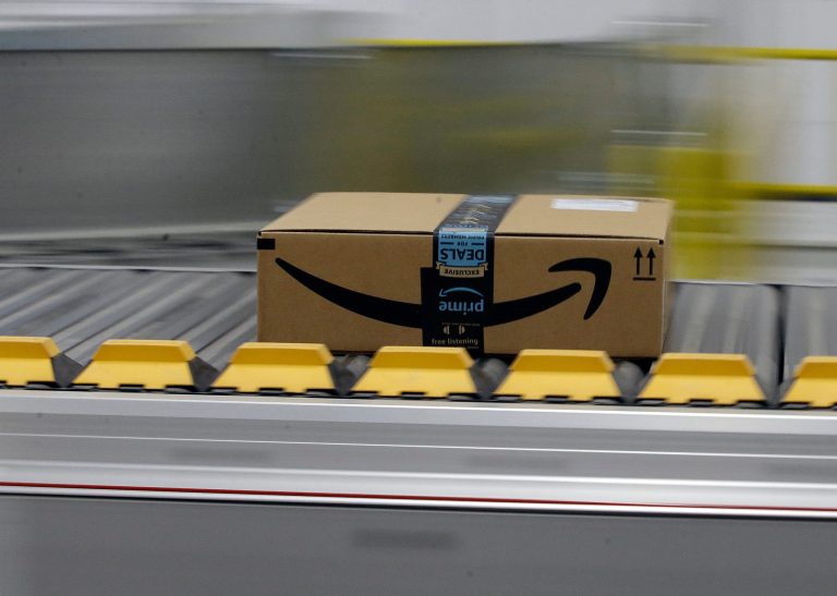 A box for an Amazon Prime customer moves through the new Amazon Fulfillment Center in Sacramento, Calif.