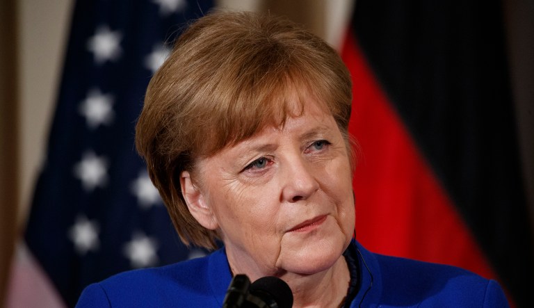 German Chancellor Angela Merkel listens during a news conference.
