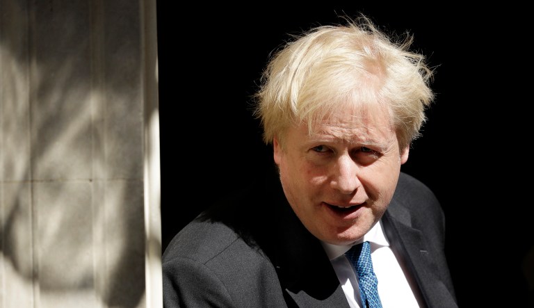Boris Johnson leaves after a meeting at 10 Downing Street in London.