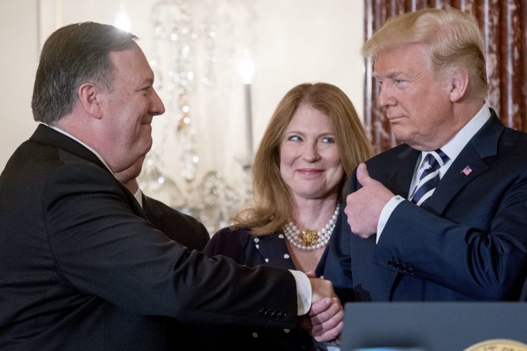 From left, Secretary of State Mike Pompeo, accompanied by his wife Susan, gets a thumbs up from President Donald Trump, after  being ceremonially sworn in at the State Department, Wednesday, May 2, 2018, in Washington. 