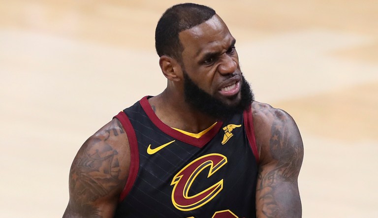 Cleveland Cavaliers' LeBron James questions a call during the first half of Game 4 of basketball's NBA Finals against the Golden State Warriors, Friday, June 8, 2018, in Cleveland.