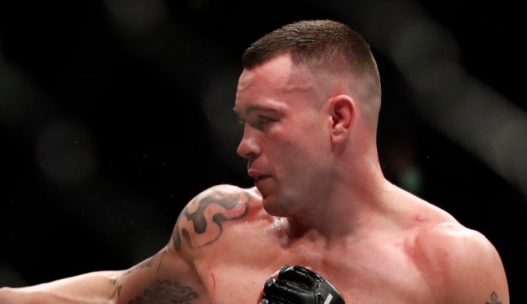 Colby Covington (shown above) fights with Rafael Dos Anjos during their interim welterweight UFC 225 Mixed Martial Arts bout  in Chicago.
