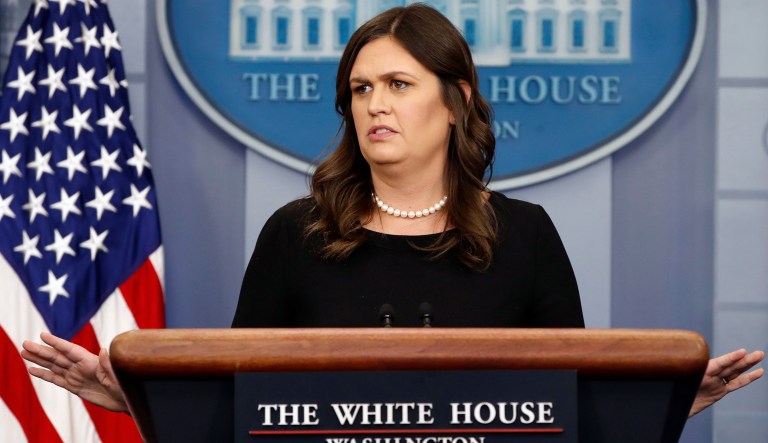 White House press secretary Sarah Huckabee Sanders gestures as she answers a question from the media during the daily briefing, Thursday, June 14, 2018, in the briefing room of the White House in Washington.