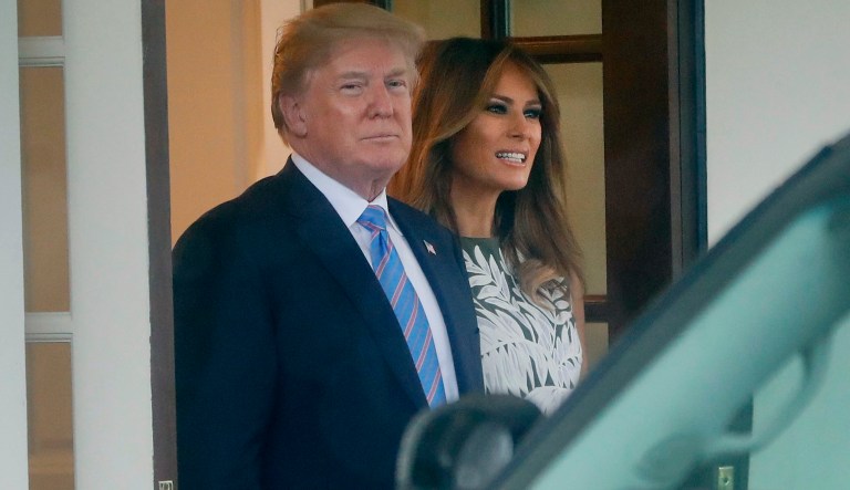President Donald Trump and first lady Melania Trump watch as the vehicle transporting Spain's King Felipe VI and Queen Letizia departs at the White House in Washington, Tuesday, June 19, 2018.