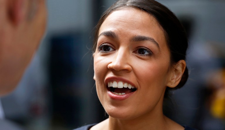 FILE - In this June 27, 2018 file photo, Democrat rising star Alexandria Ocasio-Cortez, speaks to the media in New York, the day after her congressional primary upset over 10-term incumbent Joe Crowley. Ocasio-Cortez, 28, has responded to a conservative TV host who questioned her background in the Bronx borough of New York City. Her campaign explained her family moved to Westchester's Yorktown Heights when she was 5 to attend better schools but she moved back to the Bronx after college.