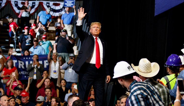President Trump waves to the cheering crowd as he leaves a rally at the Four Seasons Arena at Montana ExpoPark on Thursday in Great Falls, Mont., in support of Rep. Greg Gianforte, R-Mont., and GOP Senate candidate Matt Rosendale.