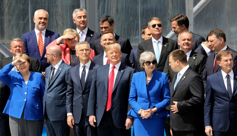 From the left, front row, German Chancellor Angela Merkel, Belgium's Prime Minister Charles Michel, NATO Secretary General Jens Stoltenberg, President Trump, Britain's Prime Minister Theresa May, Estonia's Prime Minister Juri Ratas and Slovenia's Prime Minister Miro Cerar pose for a family picture ahead of the opening ceremony of the NATO (North Atlantic Treaty Organization) summit, at the NATO headquarters in Brussels on Wednesday.