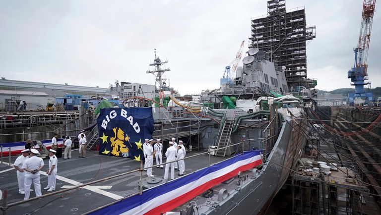 The USS John S. McCain under repair at a dry dock is seen after a rededication ceremony for at the U.S. Naval base in Yokosuka, southwest of Tokyo.
