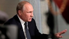Putin accuses NATO of threatening Russia