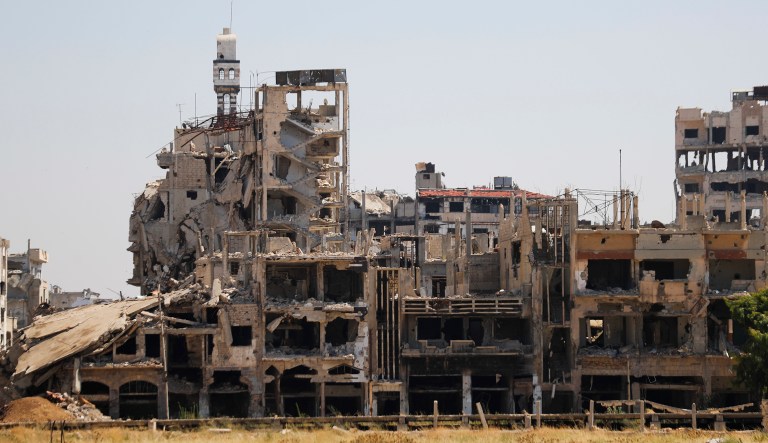 In this Tuesday photo, buildings lie in ruins in the old city of Homs, Syria.