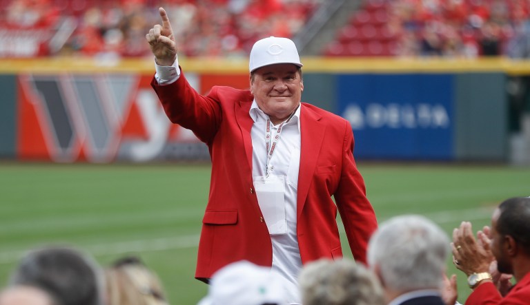 Former Cincinnati Reds player and guest Pete Ross acknowledges spectators during an Cincinnati Reds Hall of Fame induction ceremony before a baseball game against the Pittsburgh Pirates, Saturday, July 21, 2018, in Cincinnati.