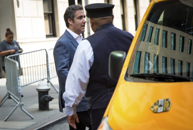 Michael Cohen, formerly a lawyer for President Trump, leaves his hotel Thursday, July 27, 2018, in New York. A new survey shows is isn't popular.