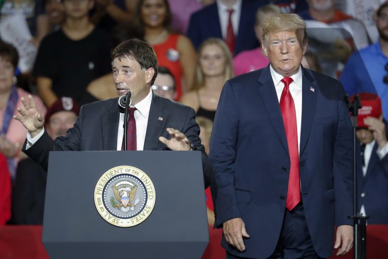 President Donald Trump, right, stands beside 12th Congressional District Republican candidate Troy Balderson, left, during a rally, Saturday, Aug. 4, 2018, in Lewis Center, Ohio. Balderson won in a paper thin victory likely to be challenged.