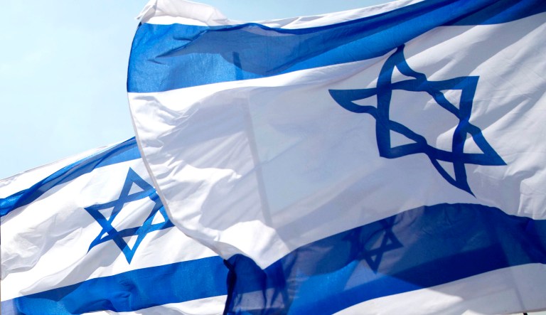 Israeli flags are seen.