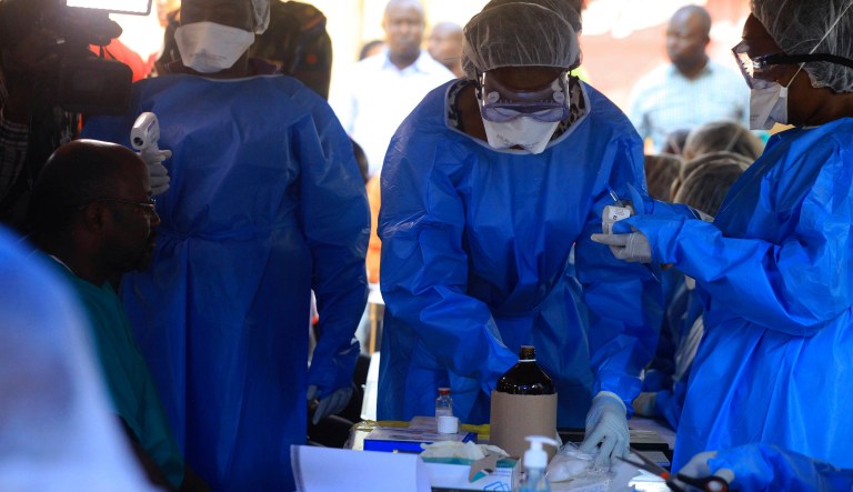 Healthcare workers from the World Health Organization prepare to give an Ebola vaccination to a front line aid worker in Beni Democratic Republic of Congo, Friday, Aug 10, 2018. The World Health Organizationâs director-general says instability, high population density and large displacement in Congoâs east mean the response to the nationâs tenth Ebola virus outbreak must be stronger than ever before. 