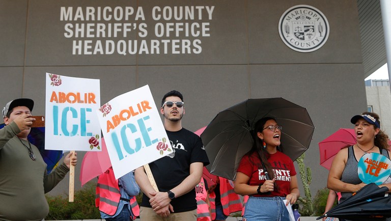 Immigration activists protest against Immigration and Customs Enforcement at the county jail.