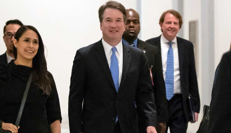 President Donald Trump's Supreme Court nominee, Judge Brett Kavanaugh, arrives to meet with Sen. Chris Coons, D-Del., a member of the Senate Judiciary Committee which will oversee his confirmation, on Capitol Hill in Washington, Thursday, Aug. 23, 2018. White House Counse Don McGahn is at right, rear.