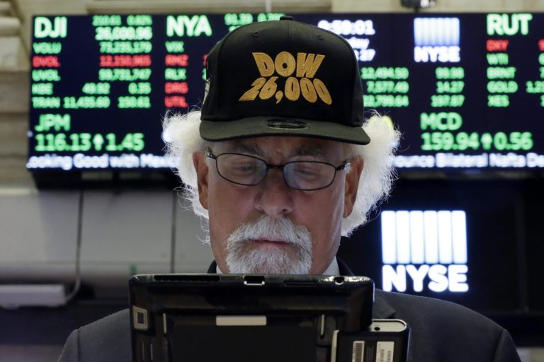 Trader Peter Tuchman wears a "Dow 26,000" hat as he works on the floor of the New York Stock Exchange. Stocks are at record highs going into September as Wall Street grows more optimistic about trade tensions easing, but investors should watch out because September is historically the worst month of the year for stocks.